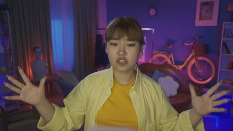 woman vlogging in a brightly lit home studio