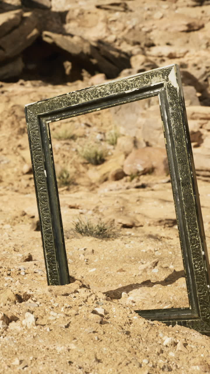Desert frame standing alone against rocky terrain in bright daylight