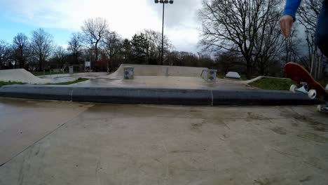 a skateboarder is seen throwing it's skateboard to the ground as it jumps on top of it taking off and riding away