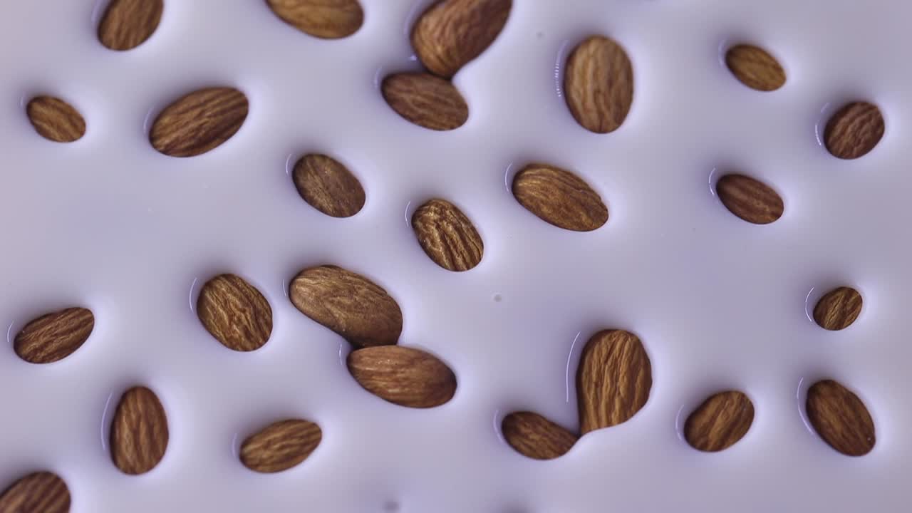 Almond nuts rising out of milk