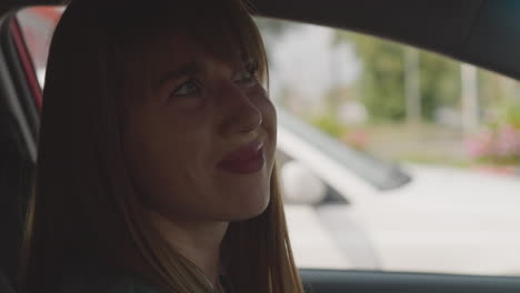 disgruntled businesswoman grumbles looking out car windows