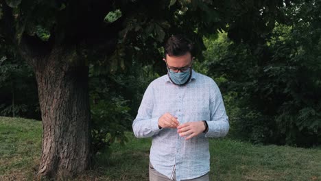 Man-in-a-mask-holds-in-his-hands-tablets