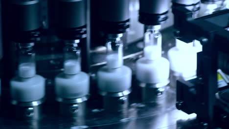 medical vials on pharmaceutical manufacturing line. quality control technology