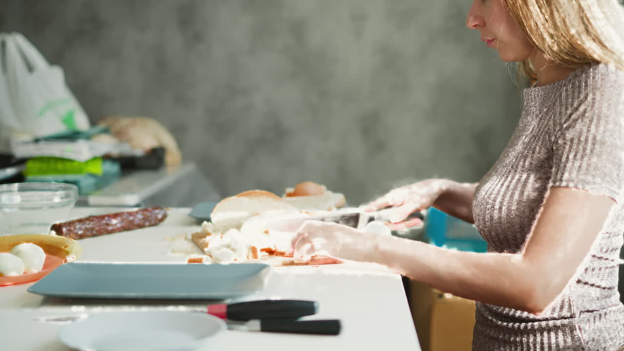 Woman preparing a sandwich