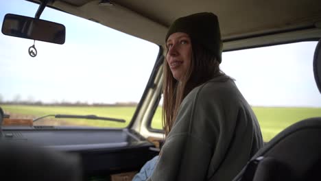 young red-haired girl with old braces as co-pilot in a caravan.