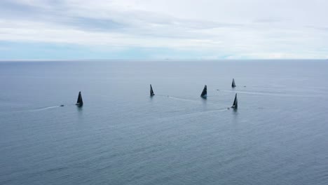 race sailboats sailing in regatta rc44 rovinj croatia - aerial drone view