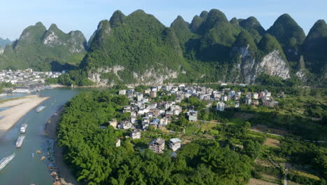 establishing drone shot of the xingping ancient town, sunny, summer day in china