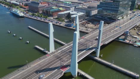 Aerial-over-the-newly-built-Hisingsbron-Bridge-over-Gota-Alv-River-In-Gothenburg-City,-Sweden