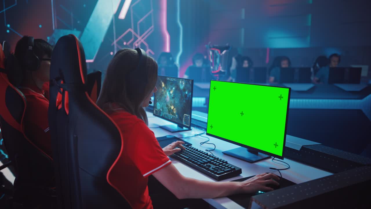 Pro Girl Plays Computer Game with Green Screen Display on a Championship. Diverse Esport Team of Pro Gamers Play in Mock-up RPG Strategy Video Game. Stylish Neon Cyber Games Arena. Side Arc View