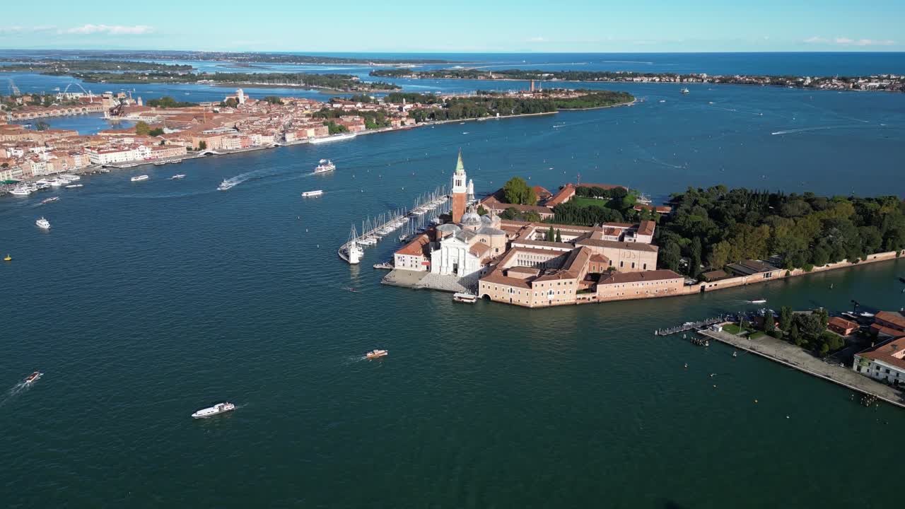 San Giorgio Maggiore Island surrounded by the Venetian Lagoon. Wide angle drone shot.