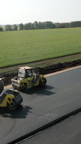 road rollers paving asphalt road