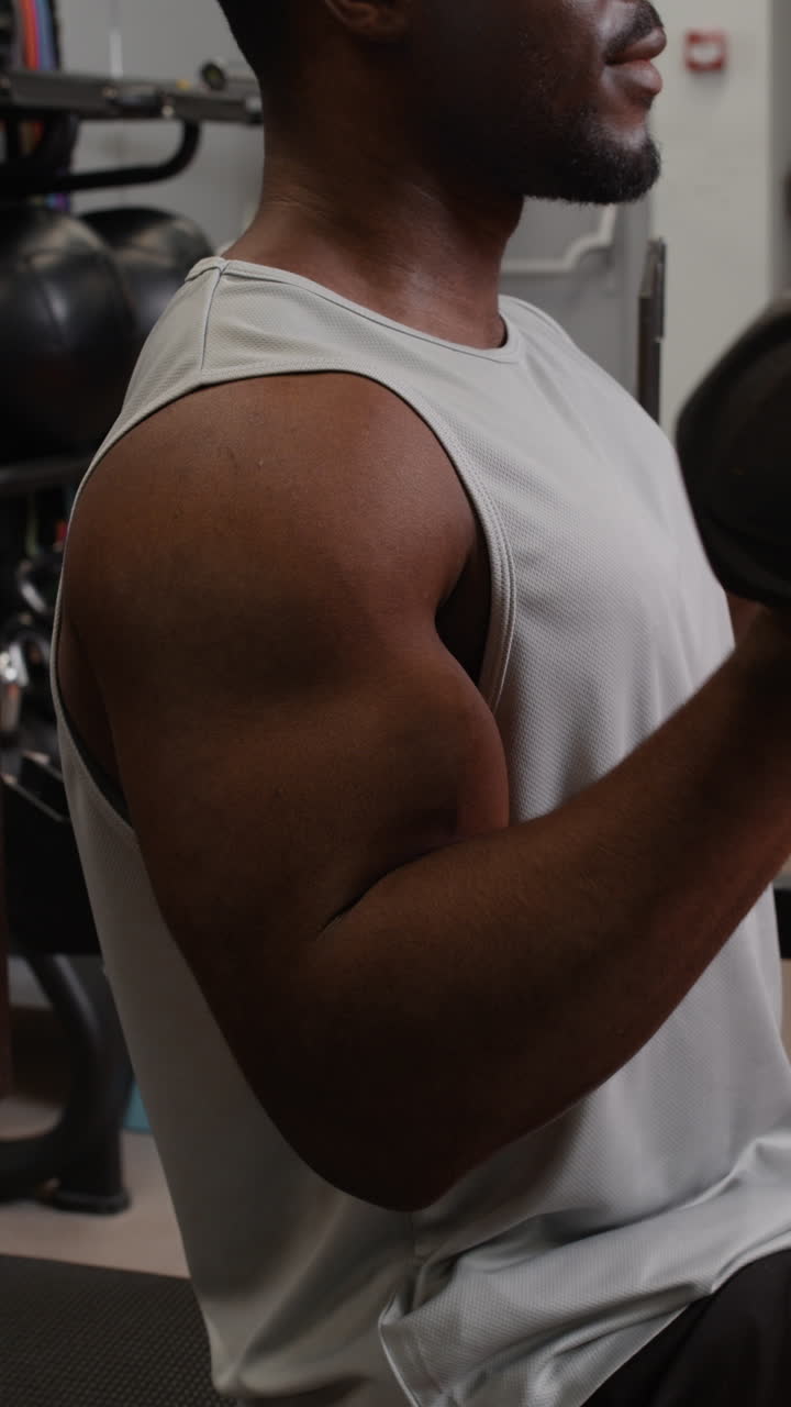 Man's Arm Muscles in Gym