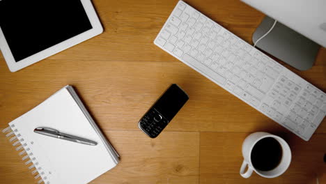 mobile phone falling onto office desk