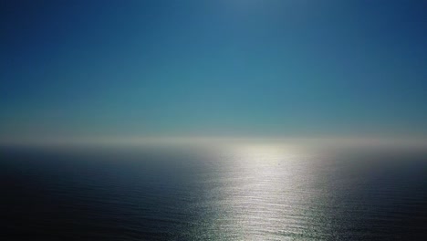 Aerial-Shot-Of-Ocean-in-suns-reflection