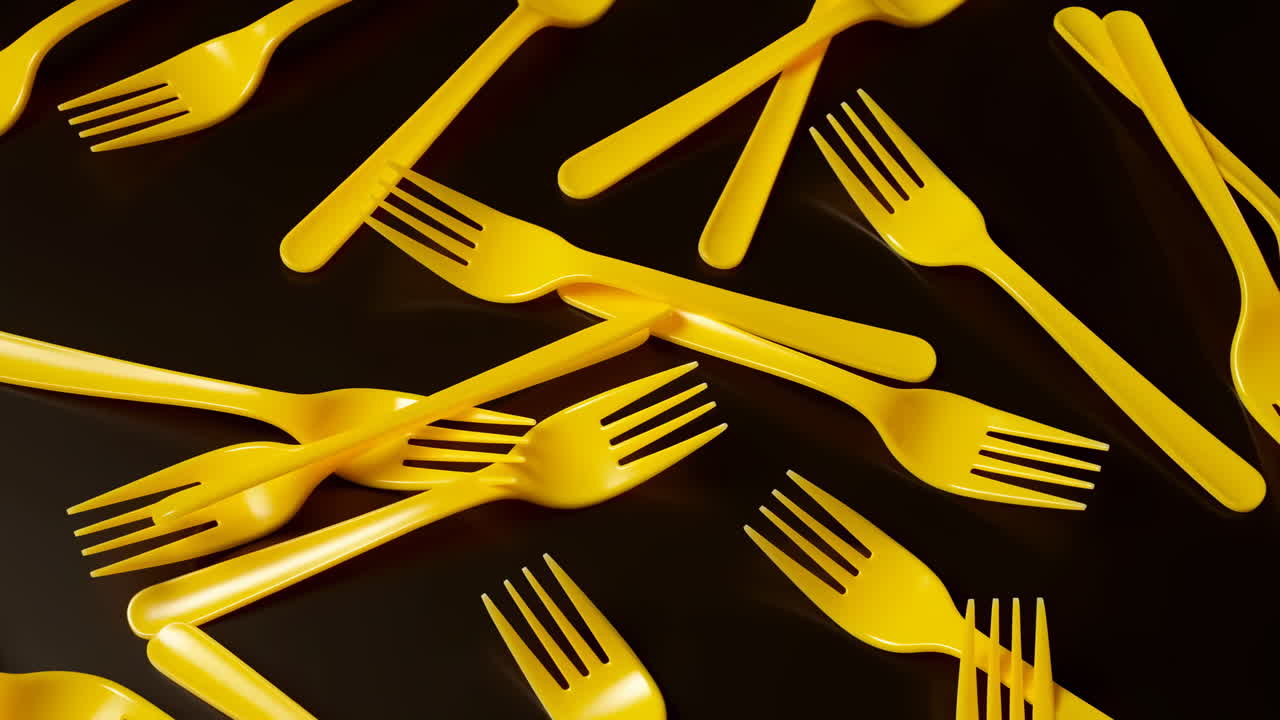 Siyah Arka Plan Üzerine Dağınık Sarı Plastik Çatallar