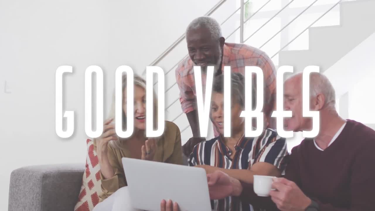 Good vibes against two senior diverse couple using laptop together at home