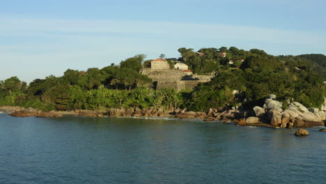 drone circling view famous landmark brazilian fortress sunset, fortaleza sao jose da ponta grossa, jurere internacional, florianopolis, santa catarina, brazil