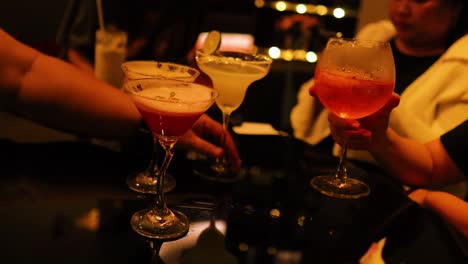 friends enjoying drinks in a lively setting