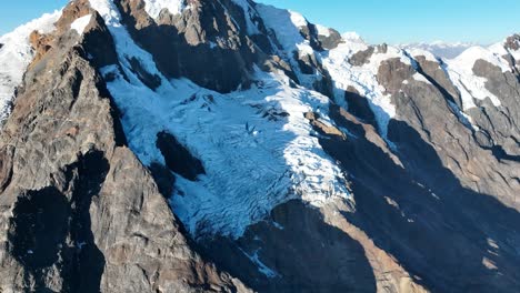 Flying-view-of-the-mountains,-snow-capped-La-Veronica,-Sacred-Valley,-Cusco