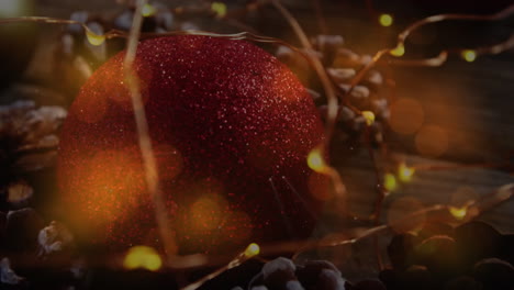 animation of christmas decorations with baubles and pine cones