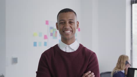 Mixed-race-man-smiling-at-camera