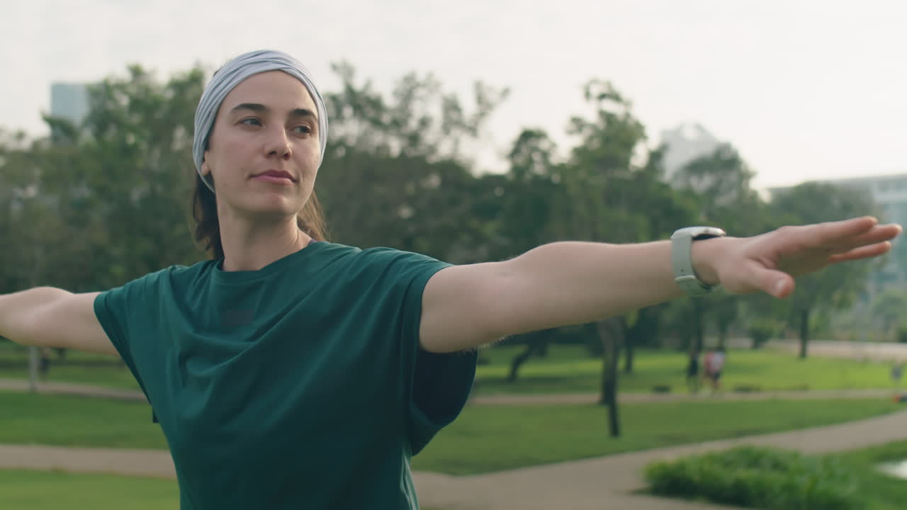 Woman Doing Asana during Yoga Practice in Park