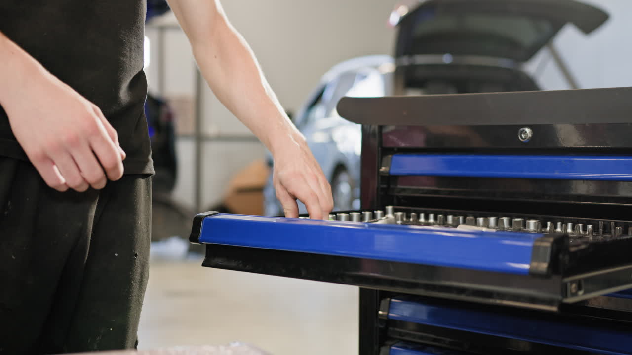 Mechanic working on car parts