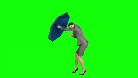 businesswoman closing her broken umbrella