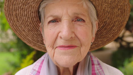 portrait of an elderly woman in a green garden