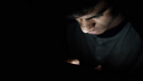 person using smartphone in the dark