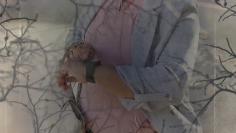 professional woman tapping smartwatch outdoors, displaying animated tech graphs and data