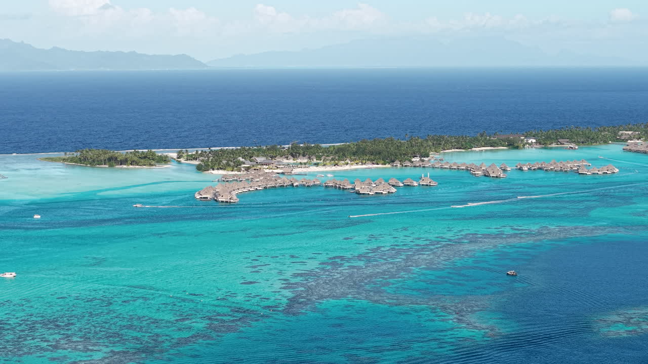 Bora Bora, French Polynesia. Aerial View of Island Lagoon and Luxury Bungalows Over Water, South Pacific Ocean Horizon