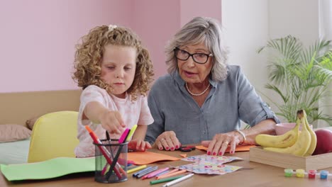 Grandmother and Grandchild Making Crafts Together
