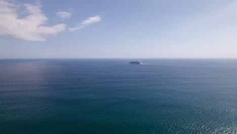 cruise-ship-at-a-distance-in-the-middle-of-the-ocean