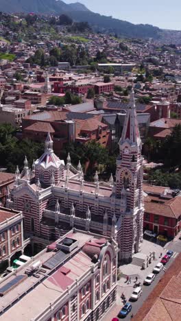 drone capturing the vibrant colors and intricate details of santuario nuestra señora del carmen in bogota. vertical video