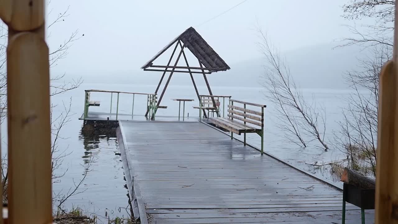 Rainy Lakeside Pier with Gazebo