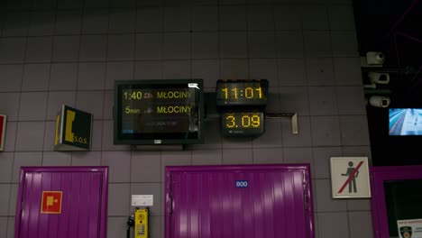 metro station platform with arrival/departure displays