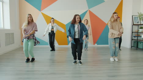 teenagers dancing in a dance studio