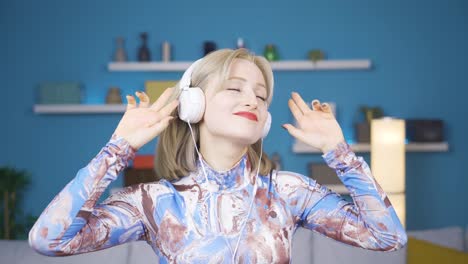 Cute-young-woman-having-fun-listening-to-music-with-headphones.