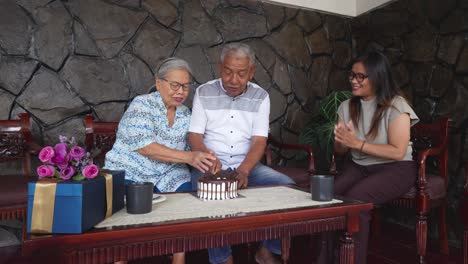 happy asian family celebrating father's birthday at home