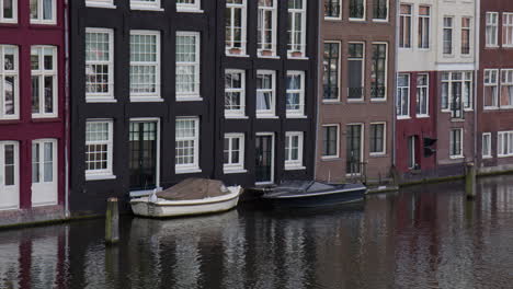 damrak waterfront buildings in amsterdam, netherlands. close-up shot