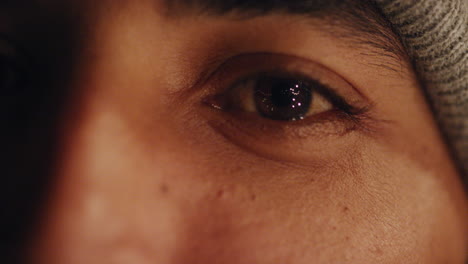 close-up-young-man-eyes-looking-happy-expression-at-night