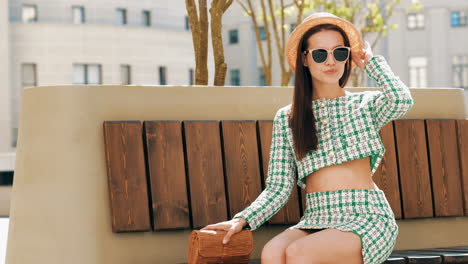 stylish woman in a green plaid outfit