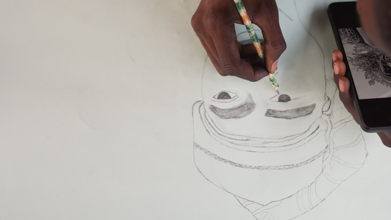 Black illustrator adding expressive lines to portrait, closeup of hands sketching with pencil beside smartphone reference, bold contours emerging, emotive atmosphere and creative flow in small studio