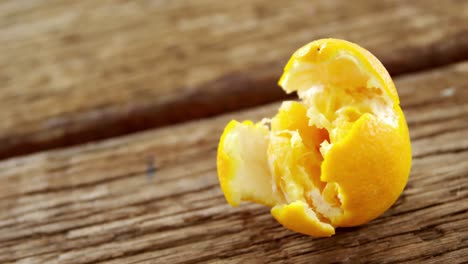 orange on wooden plank