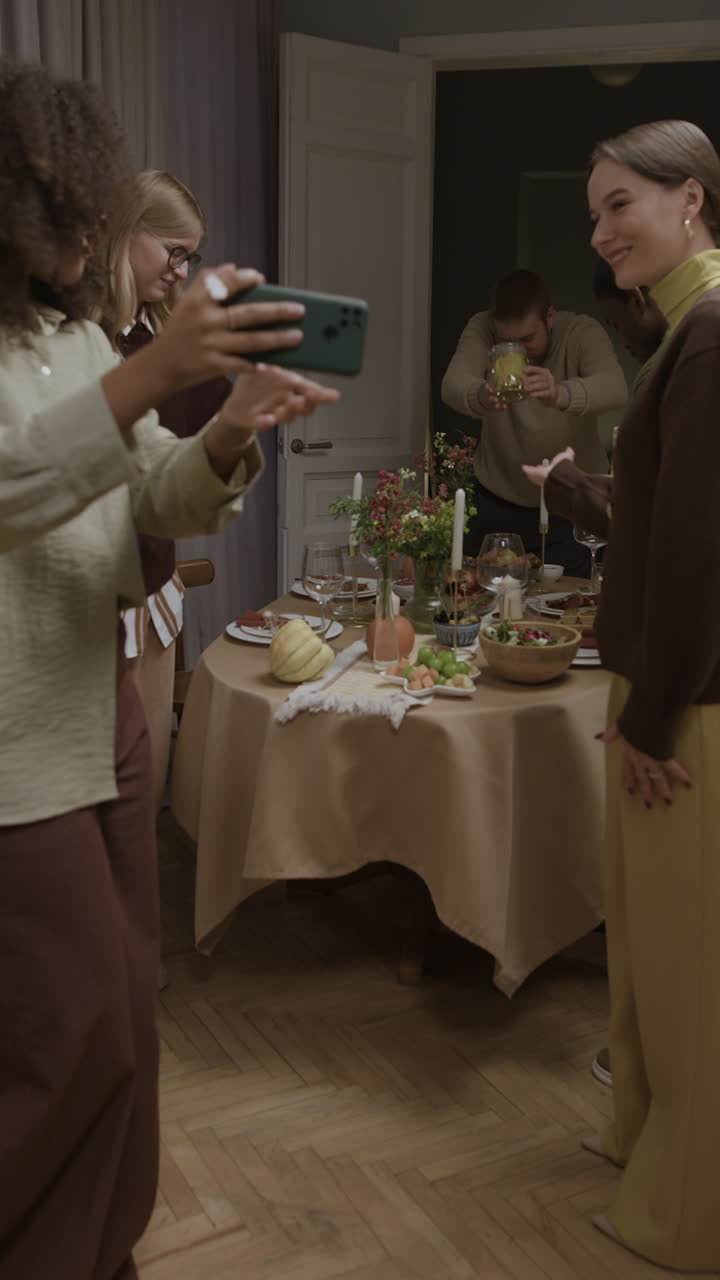 Group of people gathering at a table for a meal