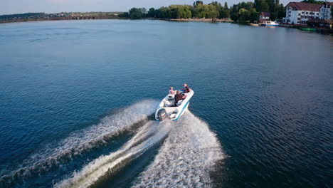 drone footage of motor boat. aerial view of boat floats alone on river