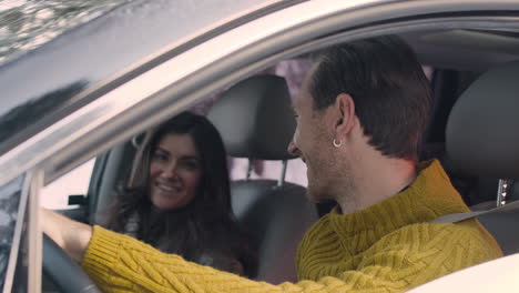 blond man in turtleneck park the car and then he removes his seat belt