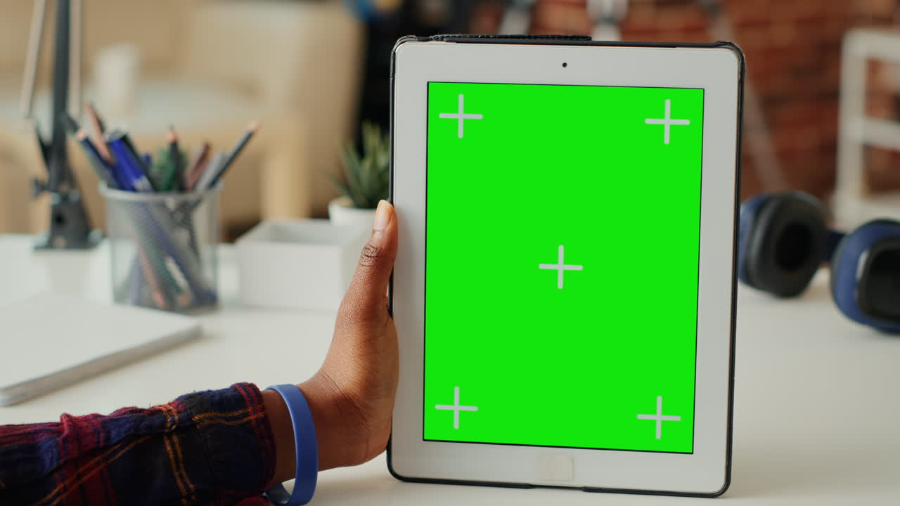 Female entrepreneur vertically holding isolated greenscreen