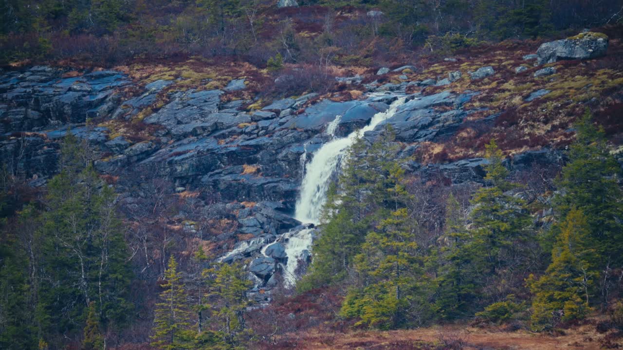 Waterfall Cascading Down On Rocks In Åfjord, Norway - Wide Shot